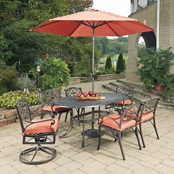 Unique retro table mat-Biscayne Rust Bronze 9-piece Outdoor Oval Dining Set with Cushioned Arm and Swivel Rocking Chairs and Umbrella by Home Styles